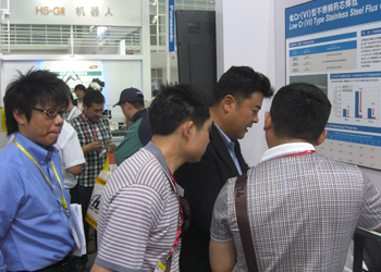 People viewing the items on display