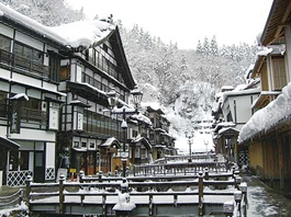 Traditional Japanese ryokan-style inns line both banks of the Ginzangawa River